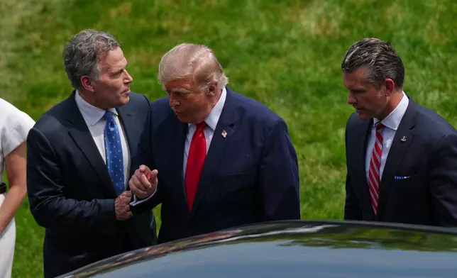 President Donald Trump walks with Sen. Dave McCormick, R-Pa., and Defense Secretary Pete Hegseth as he arrives at the United States Army War College in Carlisle, Pa., for the Pennsylvania Defense and Innovation Summit, Wednesday, July 15, 2026. (AP Photo/Julia Demaree Nikhinson)