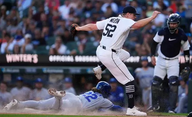 Detroit Tigers pitcher Troy Melton gets the force out at home plate on Kansas City Royals' Carter Jensen (22) on a dropped third strike on Isaac Collins during the first inning of a baseball game Thursday, July 23, 2026, in Detroit. (AP Photo/Paul Sancya)