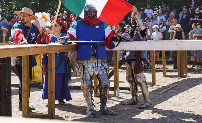A fighter from Italy awaits a battle at the International Medieval Combat Federation's World Championship at Spottrup Castle, in Spottrup, Denmark, Thursday, July 23, 2026. (AP Photo/James Brooks)
