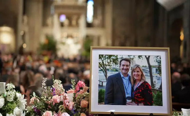 FILE - Pictures of Mark and Melissa Hortman are set up inside the sanctuary at the Basilica of St. Mary's during funeral services for Mark and Melissa Hortman in Minneapolis, Saturday, June 28, 2025. (Alex Kormann/Star Tribune via AP, Pool, File)