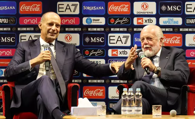 The new SSC Napoli coach, Massimiliano Allegri, left, pictured with club president Aurelio De Laurentiis, during a press conference at the San Carlo Theater, in Naples, Italy, Tuesday, July 14, 2026. (Alessandro Garofalo/LaPresse via AP)