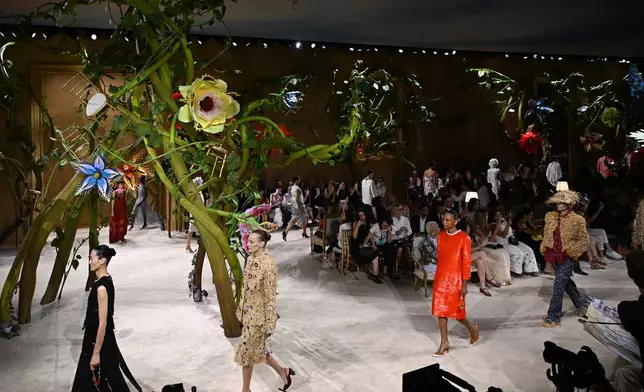 Models wear creations as part of the Chanel Haute Couture Fall/Winter 2026-2027 Women's collection presented in Paris, Tuesday, July 7, 2026. (AP Photo/Emma Da Silva)