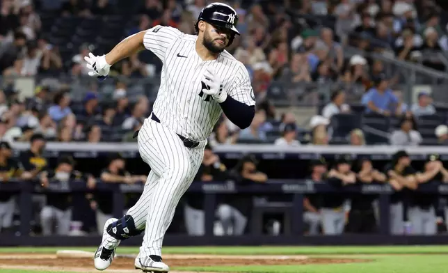 New York Yankees' Jasson Domínguez runs after hitting a run scoring double in the seventh inning during the second baseball game of a doubleheader against the Pittsburgh Pirates, Wednesday, July 22, 2026, in New York. (AP Photo/Adam Hunger)