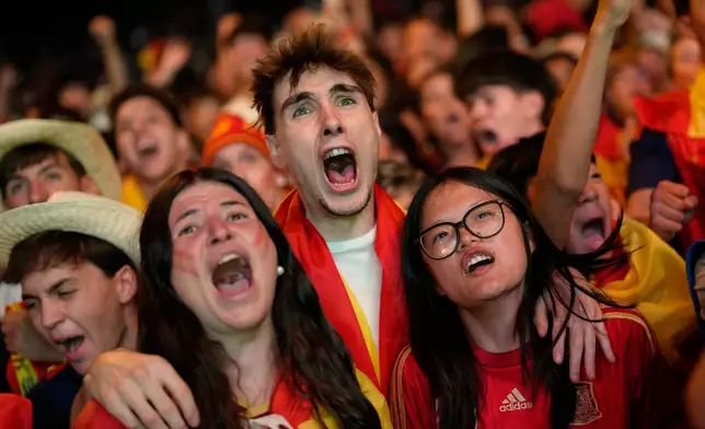 Spanish fans celebrate in central Madrid after Spain's Pedro Porro scores his side's second goal during the World Cup semifinal soccer match between France and Spain in Arlington, Texas, near Dallas, Tuesday, July 14, 2026. (AP Photo/Bernat Armangue)