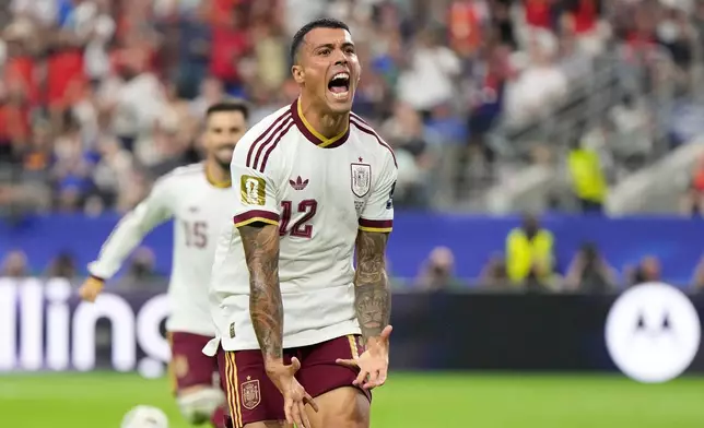 Spain's Pedro Porro reacts after scoring his side's second goal during the World Cup semifinal soccer match between France and Spain in Arlington, Texas, near Dallas, Tuesday, July 14, 2026. (AP Photo/Ashley Landis)