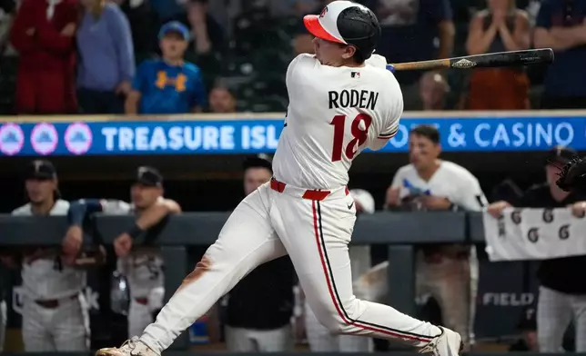 Minnesota Twins' Alan Roden (18) hits a walk-off RBI single scoring Royce Lewis in the ninth inning of a baseball game against the Cleveland Guardians, Wednesday, July 8, 2026, in Minneapolis. (AP Photo/Joseph Scheller)