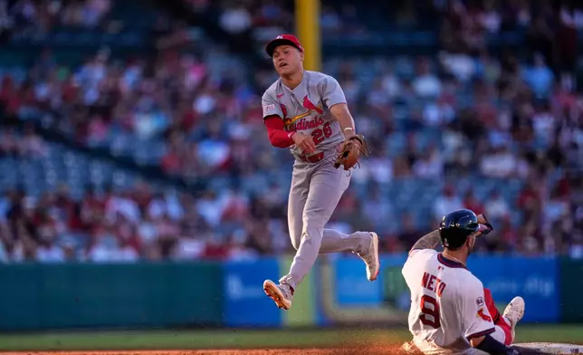 Los Angeles Angels' Zach Neto, right, is forced out at second as St. Louis Cardinals second baseman JJ Wetherholt throws out Mike Trout at first during the second inning of a baseball game Tuesday, July 21, 2026, in Anaheim, Calif. (AP Photo/Mark J. Terrill)