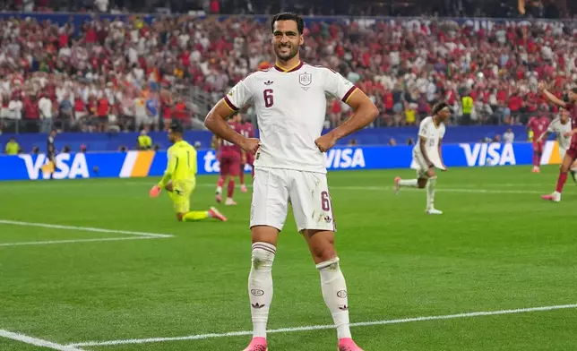 Spain's Mikel Merino (6) celebrates scoring his side's opening goal during the World Cup round of 16 soccer match between Portugal and Spain in Arlington, Texas, near Dallas, Monday, July 6, 2026. (AP Photo/Julio Cortez)