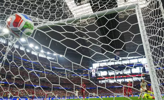 Spain's Mikel Merino (6) scores their opening goal during the World Cup round of 16 soccer match between Portugal and Spain in Arlington, Texas, near Dallas, Monday, July 6, 2026. (AP Photo/Julio Cortez)