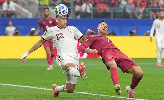 Spain's Pau Cubarsi (22) and Portugal's Cristiano Ronaldo (7) vie for the ball during the World Cup round of 16 soccer match between Portugal and Spain in Arlington, Texas, near Dallas, Monday, July 6, 2026. (AP Photo/Julio Cortez)
