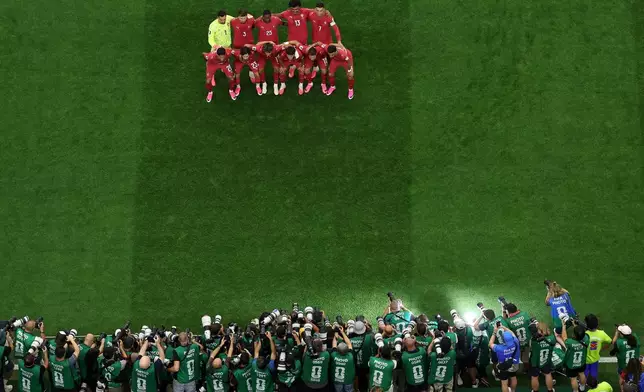 Portugal players pose for a photo before a World Cup round of 16 soccer match against Spain in Arlington, Texas, near Dallas, Monday, July 6, 2026. (AP Photo/Sam Hodde)