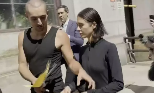 Angelina Nikolau and Ivan Kuznetsov, who go by Angela Nikolau and Ivan Beerkus, depart New York criminal courthouse building on Thursday, July 2, 2026. (AP Photo/Jennifer Peltz)