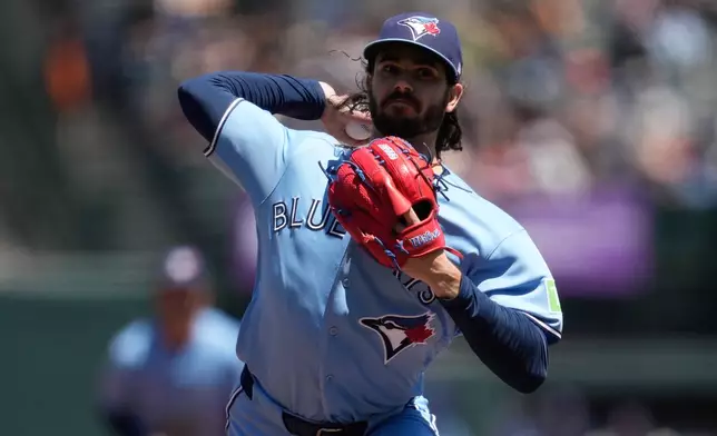 Toronto Blue Jays pitcher Dylan Cease throws against the San Francisco Giants during the fifth inning of a baseball game Wednesday, July 8, 2026, in San Francisco. (AP Photo/Jeff Chiu)