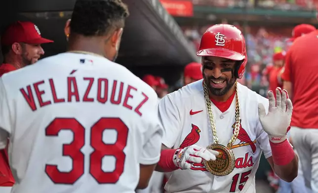 St. Louis Cardinals' José Fermín (15) is congratulated by teammate Nelson Velázquez (38) after hitting a solo home run during the fourth inning of a baseball game against the Milwaukee Brewers Wednesday, July 8, 2026, in St. Louis. (AP Photo/Jeff Roberson)