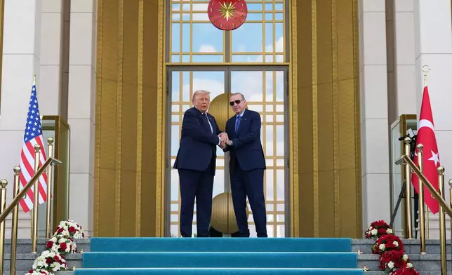 President Donald Trump shakes hands with Turkish President Recep Tayyip Erdogan at the Bestepe Presidential Palace during a formal welcome for the NATO summit in Ankara, Turkey, Tuesday, July 7, 2026.(AP Photo/Alex Brandon)