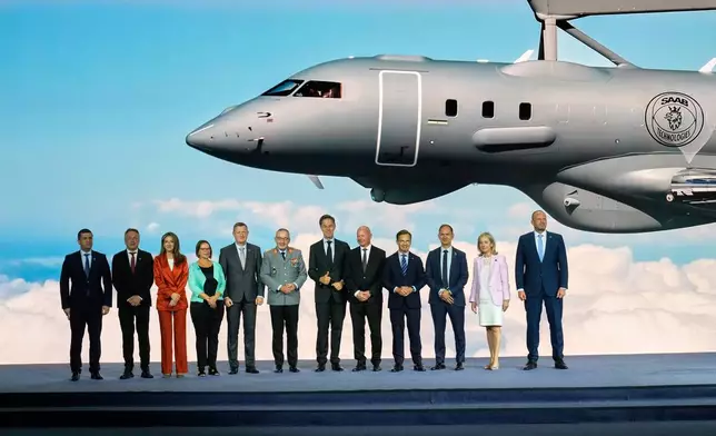 NATO Secretary General Mark Rutte, center, poses with NATO defense ministers and industry representatives during the opening of the NATO Defense Industry Forum on the sidelines of the NATO summit in Ankara, Turkey, Tuesday, July 7, 2026. (AP Photo/Hussein Malla)