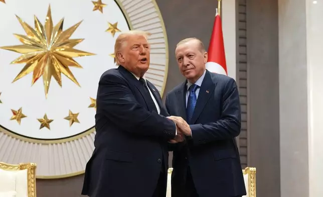 President Donald Trump shakes hands with Turkish President Recep Tayyip Erdogan upon arriving for the NATO summit in Ankara, Turkey, Tuesday, July 7, 2026. (AP Photo/Alex Brandon)