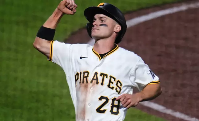Pittsburgh Pirates' Jake Mangum celebrates after scoring on a single by Brandon Lowe off Arizona Diamondbacks pitcher Merrill Kelly during the sixth inning of a baseball game in Pittsburgh, Monday, July 27, 2026. (AP Photo/Gene J. Puskar)