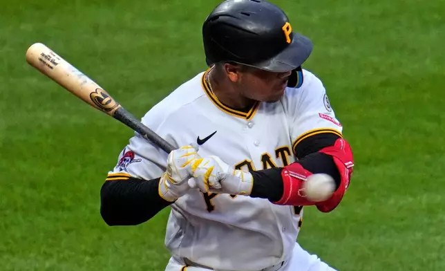 Pittsburgh Pirates' Esmerlyn Valdez is hit by a pitch from Arizona Diamondbacks' Merrill Kelly during the fourth inning of a baseball game in Pittsburgh, Monday, July 27, 2026. (AP Photo/Gene J. Puskar)