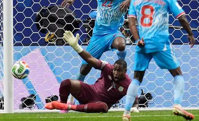 Congo goalkeeper Lionel Mpasi blocks a shot during a World Cup round of 32 soccer match against England in Atlanta, Wednesday, July 1, 2026. (AP Photo/Mike Stewart)