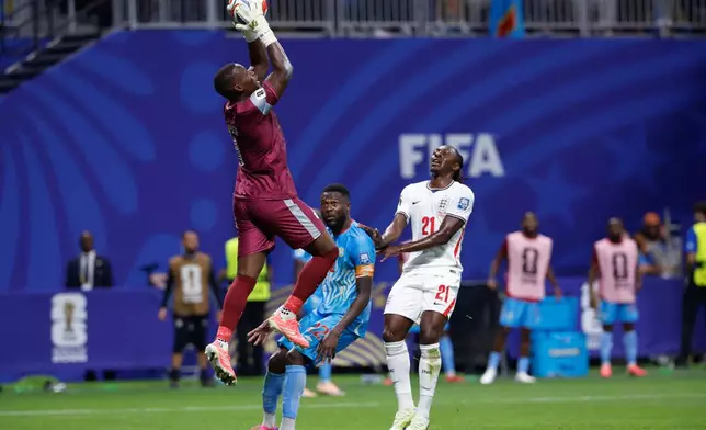Congo goalkeeper Lionel Mpasi (1) save the ball during the World Cup round of 32 soccer match between England and Congo in Atlanta, Wednesday, July 1, 2026. (AP Photo/Butch Dill)