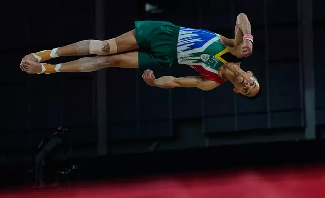 South Africa's Danile Mclean competes at the Floor Exercise during men's team final and individual qualification of Artistic Gymnastics at the Commonwealth Games in Glasgow, Scotland, Friday, July 24, 2026. (AP Photo/Manish Swarup)