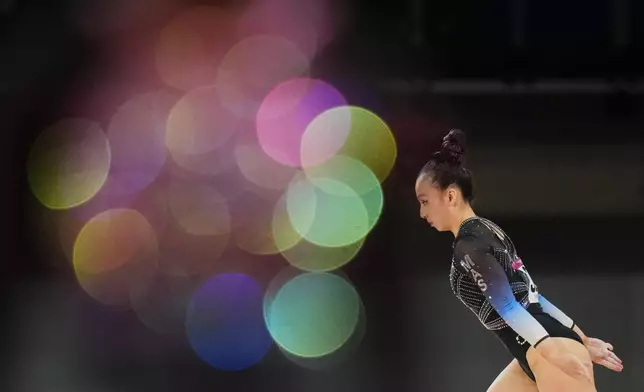 Malaysia's Yeap Kang Xian competes on the balance beam during the women's team final and individual qualification of Artistic Gymnastics at the Commonwealth Games in Glasgow, Scotland, Saturday, July 25, 2026. (AP Photo/Kin Cheung)