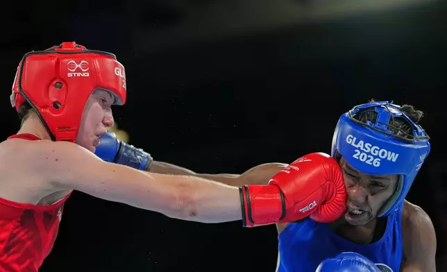 England's Lauren Mackie, left, and Kenya's Amina Faki, compete during the Women's 54kg round of 32 boxing bout during the Commonwealth Games in Glasgow, Scotland, Friday, July 24, 2026. (AP Photo/Kin Cheung)