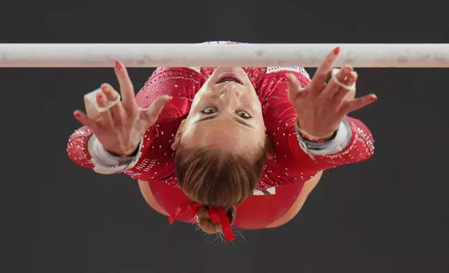 England's Ruby Stacey competes on the uneven bars during the women's team final and individual qualification of Artistic Gymnastics at the Commonwealth Games in Glasgow, Scotland, Saturday, July 25, 2026. (AP Photo/Kin Cheung)