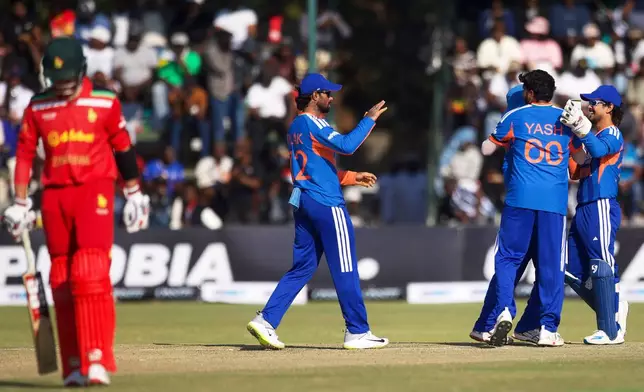 India's players celebrate the wicket of Zimbabwe's batsman Brian Bennett, left, during the second T20 cricket match between Zimbabwe and India in Harare, Zimbabwe, Saturday, July 25, 2026. (AP Photo/Wonder Mashura)