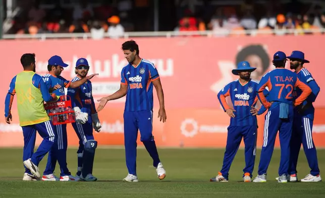 India's players celebrate a wicket during the second T20 cricket match between Zimbabwe and India in Harare, Zimbabwe, Saturday, July 25, 2026. (AP Photo/Wonder Mashura)