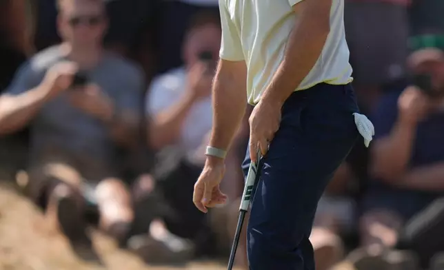 Rory McIlroy of Northern Ireland reacts after missing a putt on the 1st green during the first day of the British Open Golf championships at Royal Birkdale golf club, in Southport, England, Thursday, July 16, 2026. (AP Photo/David Goldman)
