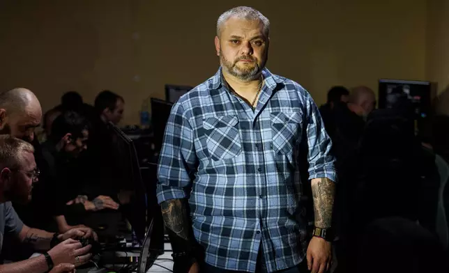 A Ukrainian commander aka "Kat" of K-2 brigade of the Unmanned Systems Forces poses for photos at a command center at an undisclosed location, Ukraine, Saturday, June 20, 2026. (AP Photo/Evgeniy Maloletka)