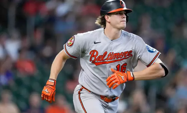 Baltimore Orioles' Coby Mayo watches his solo home run against the Houston Astros as he rounds the bases during the sixth inning of a baseball game Sunday, July 19, 2026, in Houston. (AP Photo/Eric Christian Smith)