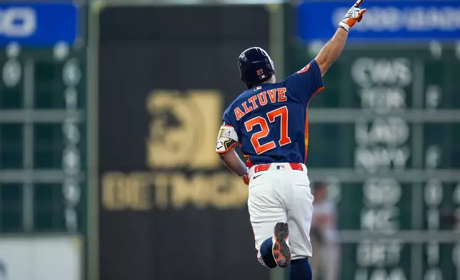 Houston Astros' Jose Altuve reacts after hitting a solo home run against the Baltimore Orioles during the eighth inning of a baseball game Sunday, July 19, 2026, in Houston. (AP Photo/Eric Christian Smith)
