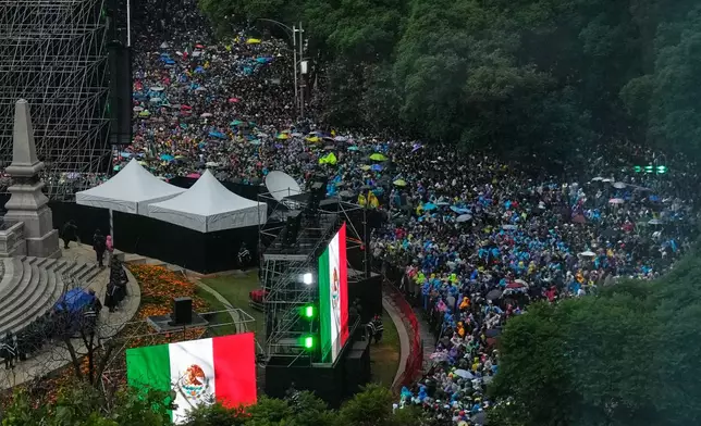 Soccer fans gather for a watch party for the World Cup soccer match between Mexico and Ecuador, at the base of the Angel of Independence monument in Mexico City, Tuesday, June 30, 2026. (AP Photo/Marco Ugarte)