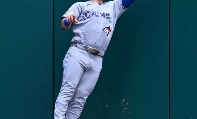 Toronto Blue Jays center fielder Daulton Varsho catches a fly ball at the fence hit by Washington Nationals' Luis García Jr. during the first inning of a baseball game, Wednesday, July 29, 2026, in Washington. (AP Photo/John McDonnell)