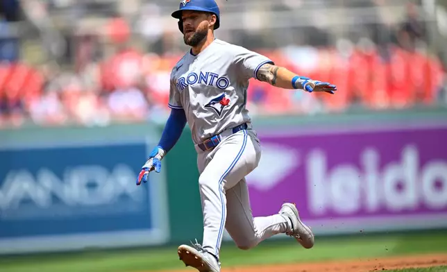 Toronto Blue Jays' Nathan Lukes advances to third base on a teammate Kazuma Okamoto's single during the first inning of a baseball game against the Washington Nationals, Wednesday, July 29, 2026, in Washington. (AP Photo/John McDonnell)
