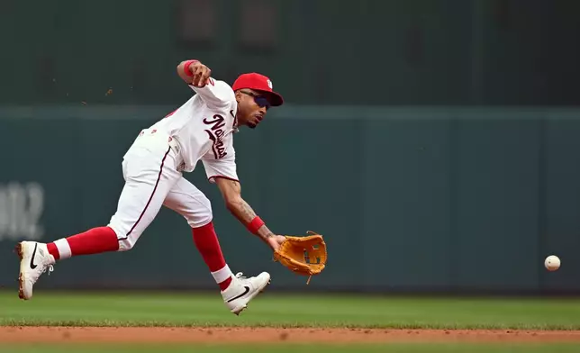 Washington Nationals short stop Nasim Nuñez fields a ground ball before throwing out Toronto Blue Jays' Ernie Clement during the second inning of a baseball game, Wednesday, July 29, 2026, in Washington. (AP Photo/John McDonnell)