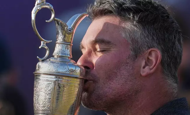 Ryan Fox of New Zealand kisses the Claret Jug trophy after winning the British Open Golf championships at Royal Birkdale golf club, in Southport, England, Sunday, July 19, 2026. (AP Photo/Jon Super)