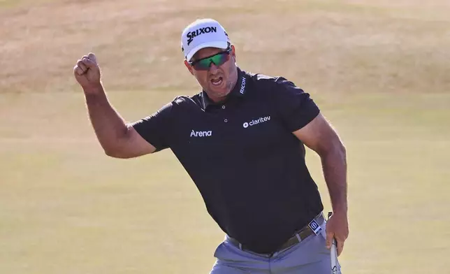 Ryan Fox of New Zealand celebrates on the 18th green after winning the British Open Golf championships at Royal Birkdale golf club, in Southport, England, Sunday, July 19, 2026. (AP Photo/Peter Morrison)