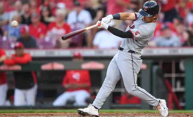 Cleveland Guardians' Steven Kwan hits a single during the third inning of a baseball game against the Cincinnati Reds in Cincinnati, Wednesday, July 29, 2026. (AP Photo/Tanner Pearson)