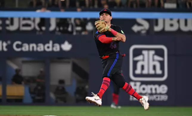 Toronto Blue Jays second baseman Luis Urias throws to first base to put out Chicago White Sox's Sam Antonacci during the first inning of a baseball game in Toronto, Friday, July 17, 2026. (Jon Blacker/The Canadian Press via AP)