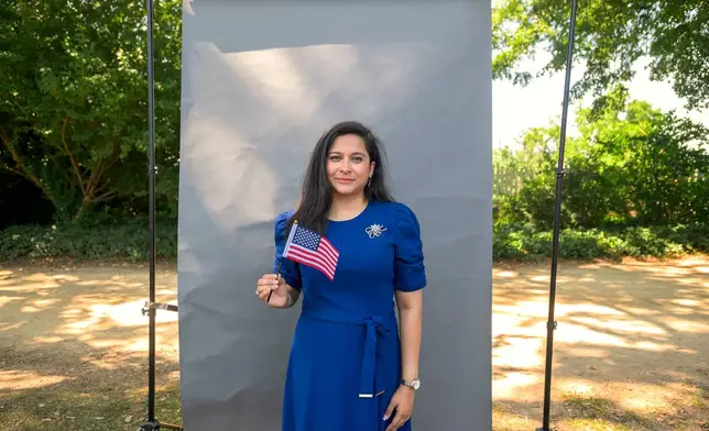 New U.S. citizen Anita Nawshin, from Bangladesh, poses for a portrait following a naturalization ceremony on Independence Day at George Washington's Mount Vernon, Saturday, July 4, 2026, in Alexandria, Va. (AP Photo/Rod Lamkey, Jr.)