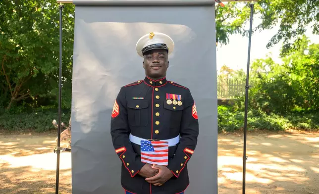 New U.S. citizen and twice-deployed U.S. Marine Sgt. Diakaria Sangare, from Guinea, poses for a portrait following the naturalization ceremony on Independence Day at George Washington's Mount Vernon, Saturday, July 4, 2026, in Alexandria, Va. (AP Photo/Rod Lamkey, Jr.)