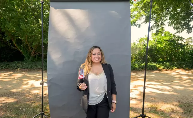 New U.S. citizen Yosselin May, from Honduras, poses for a portrait following a naturalization ceremony on Independence Day at George Washington's Mount Vernon, Saturday, July 4, 2026, in Alexandria, Va. (AP Photo/Rod Lamkey, Jr.)
