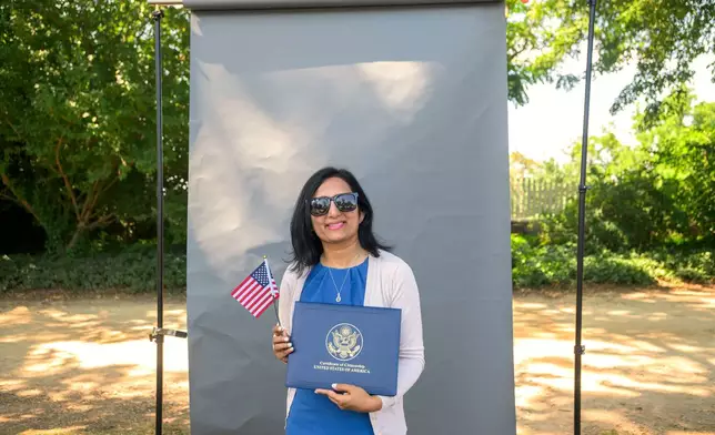 New U.S. citizen Raina Pinto, from India, poses for a portrait following a naturalization ceremony on Independence Day at George Washington's Mount Vernon, Saturday, July 4, 2026, in Alexandria, Va. (AP Photo/Rod Lamkey, Jr.)