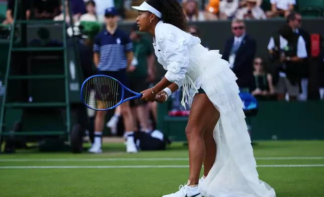 Naomi Osaka of Japan warms up before her second round women's singles match against Anastasia Gasanova of Russia at the Wimbledon Tennis Championships in London, Wednesday, July 1, 2026.(AP Photo/Kirsty Wigglesworth)