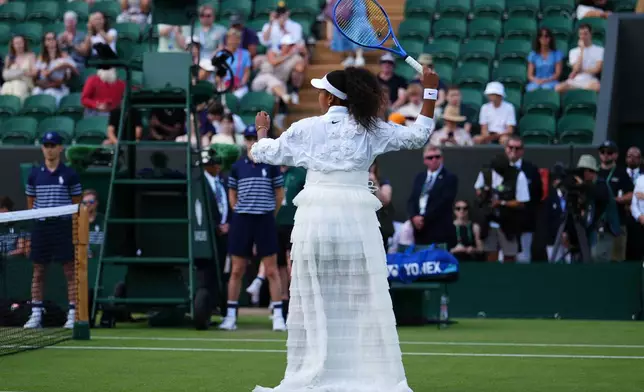 Naomi Osaka of Japan enters the court for the second round women's singles match against Anastasia Gasanova of Russia at the Wimbledon Tennis Championships in London, Wednesday, July 1, 2026.(AP Photo/Kirsty Wigglesworth)