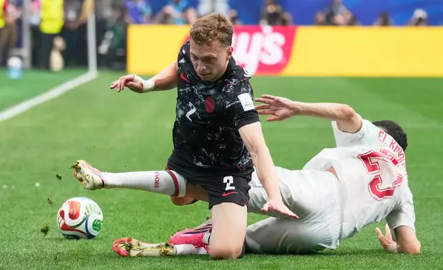 Canada's Alistair Johnston, front, and Morocco's Bilal El Khannouss battle for the ball during the World Cup round of 16 soccer match in Houston, Saturday, July 4, 2026. (AP Photo/David J. Phillip)